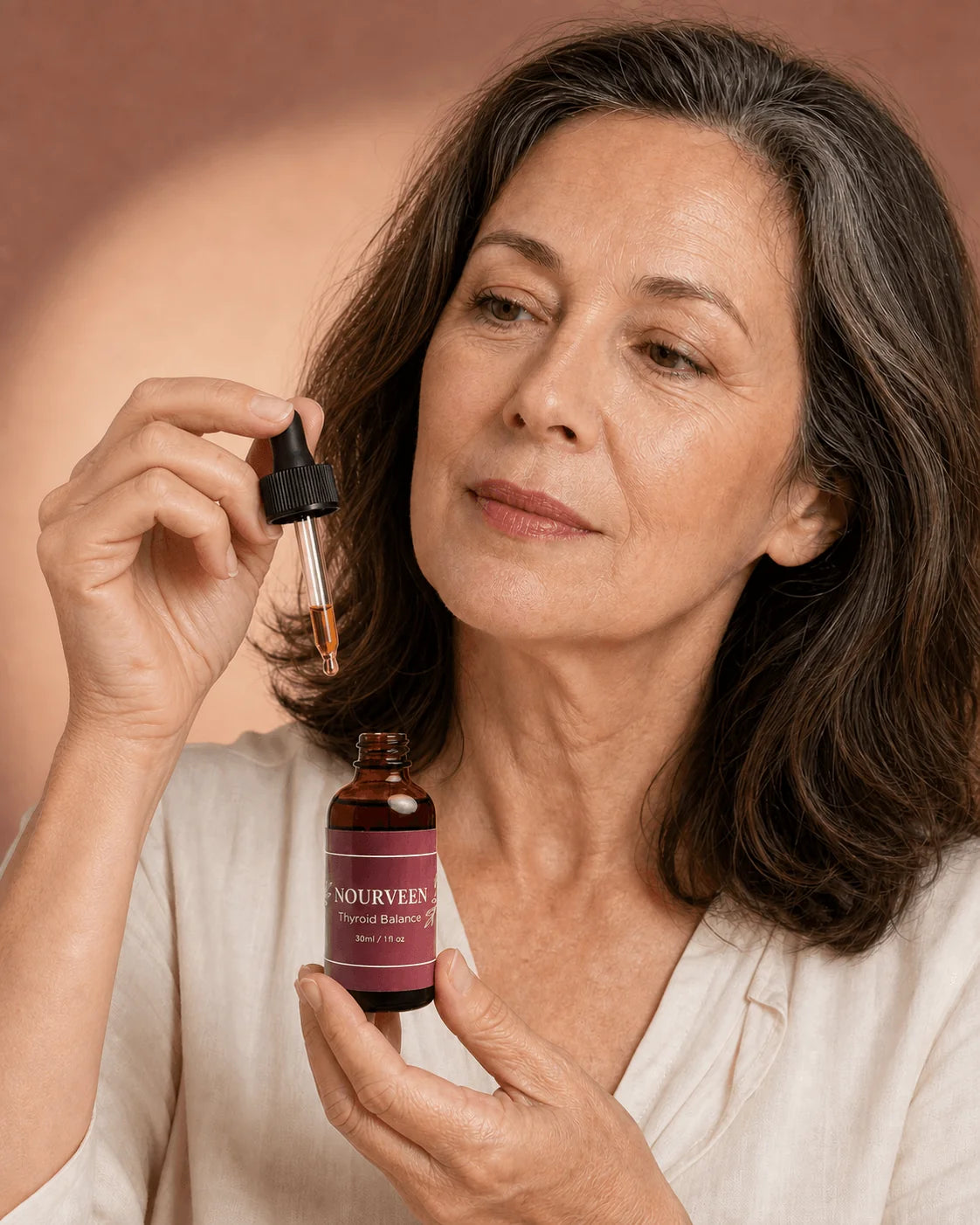 Woman using Nourveen liquid thyroid support